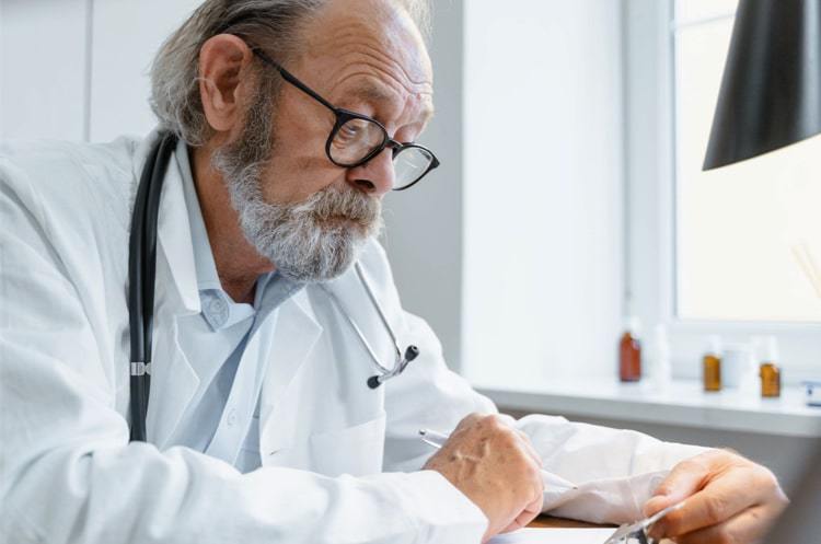A doctor looking at medical records